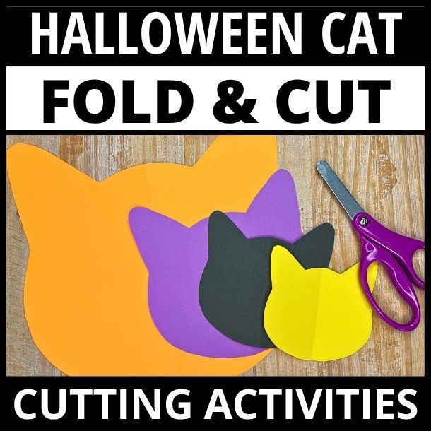 Stacked orange, purple, black, and yellow cat head cutouts with purple scissors on wooden surface for fold and cut activity