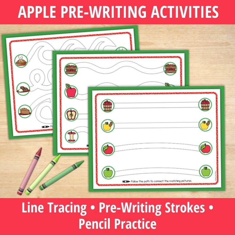 Stacked apple-themed pre-writing worksheets with line tracing paths, apple matching activities, and crayons on wood surface.
