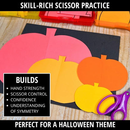 Pink, yellow, and orange pumpkin shapes on black paper with purple scissors, demonstrating fold-and-cut Halloween activity.