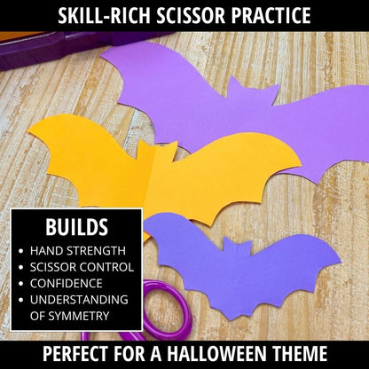 Purple, yellow, and blue bat shapes cut from folded paper, demonstrating scissor control and symmetry for Halloween cutting